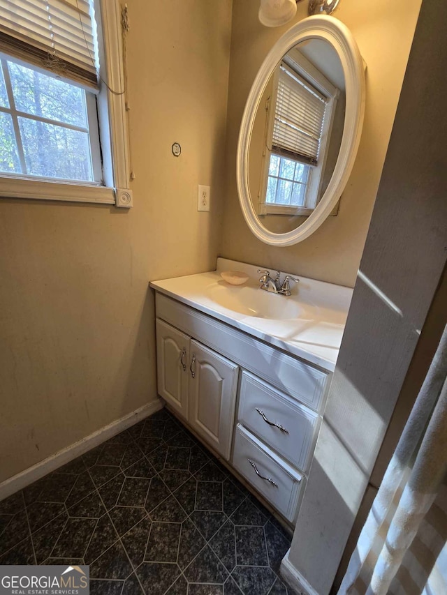 bathroom with vanity and plenty of natural light