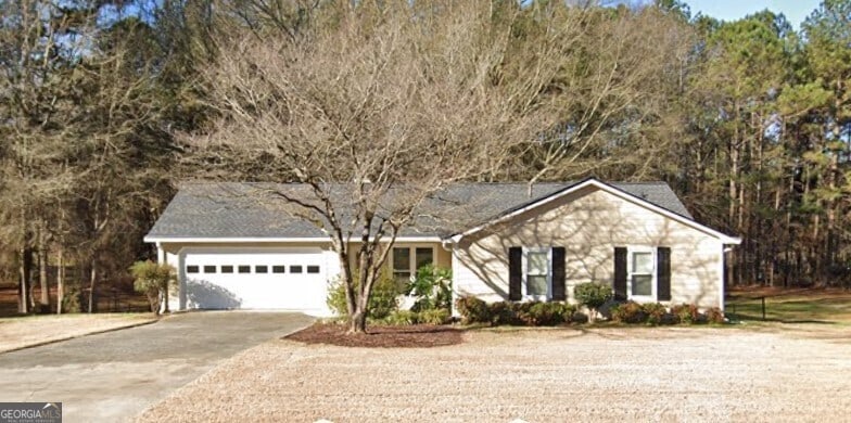 single story home with a garage