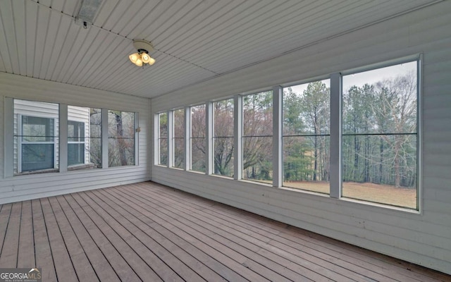 unfurnished sunroom with a wealth of natural light