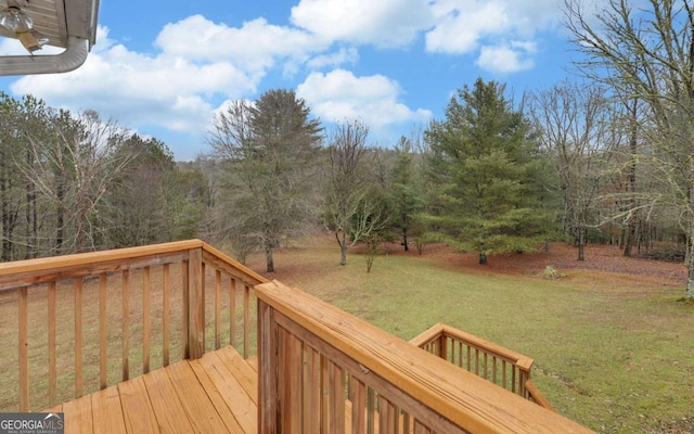 wooden deck with a yard