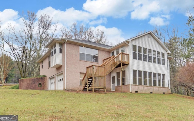 rear view of property featuring a garage, a sunroom, and a lawn