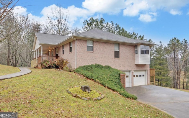 view of side of home with a yard and a garage