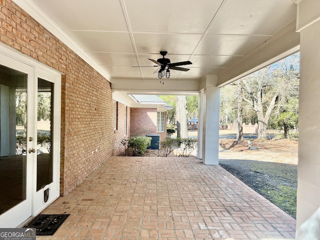 view of patio / terrace featuring a ceiling fan and french doors