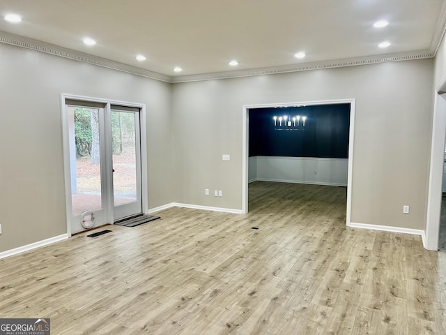 unfurnished room featuring ornamental molding, light wood-style flooring, visible vents, and recessed lighting