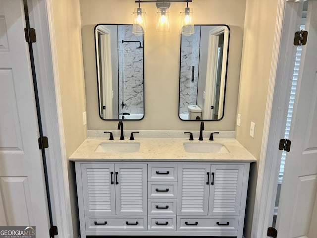 bathroom with double vanity and a sink