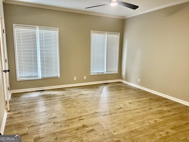 unfurnished room with ceiling fan, crown molding, baseboards, and light wood-style floors