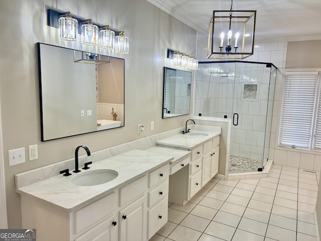 bathroom with a shower stall, ornamental molding, a sink, and tile patterned floors