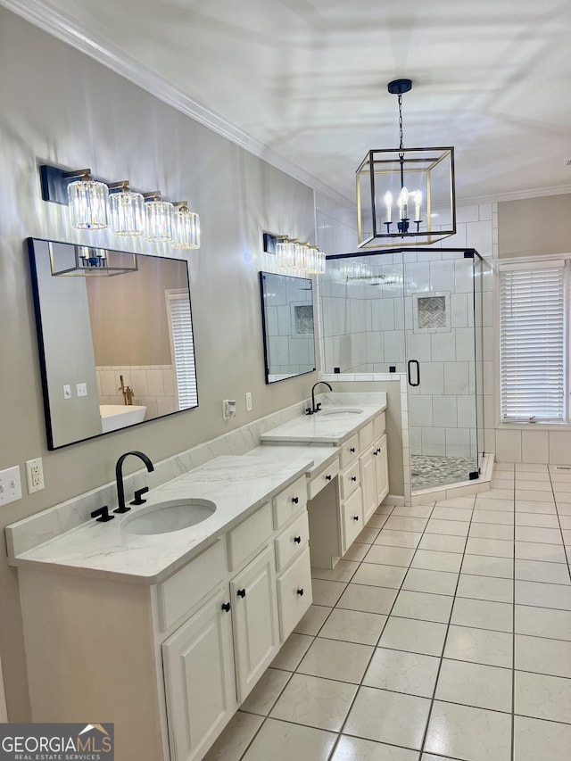 full bath featuring a shower stall, ornamental molding, a sink, and tile patterned floors