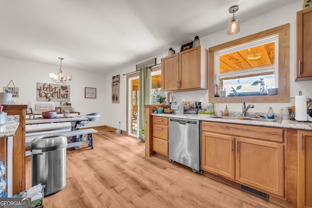 kitchen with sink, a chandelier, light hardwood / wood-style flooring, stainless steel dishwasher, and pendant lighting