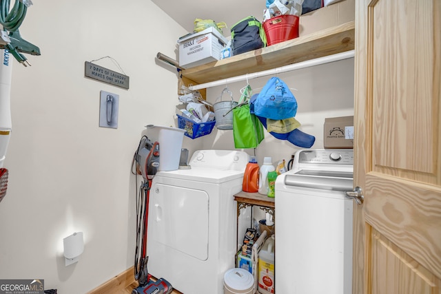 clothes washing area featuring independent washer and dryer