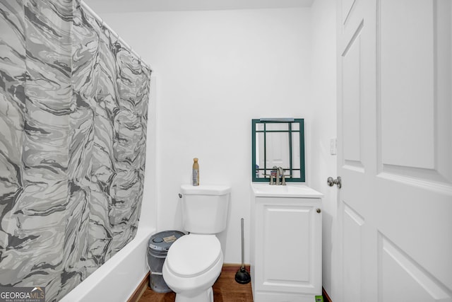 full bathroom featuring shower / tub combo with curtain, vanity, toilet, and hardwood / wood-style floors