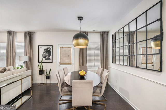 dining space featuring dark hardwood / wood-style flooring