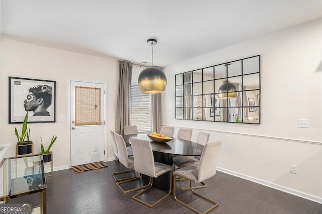 dining space featuring dark hardwood / wood-style floors