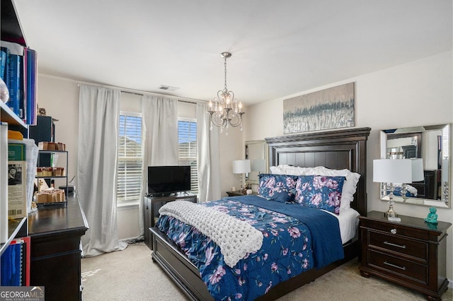 bedroom with light carpet and a chandelier