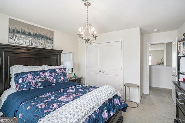 carpeted bedroom with a notable chandelier and a closet