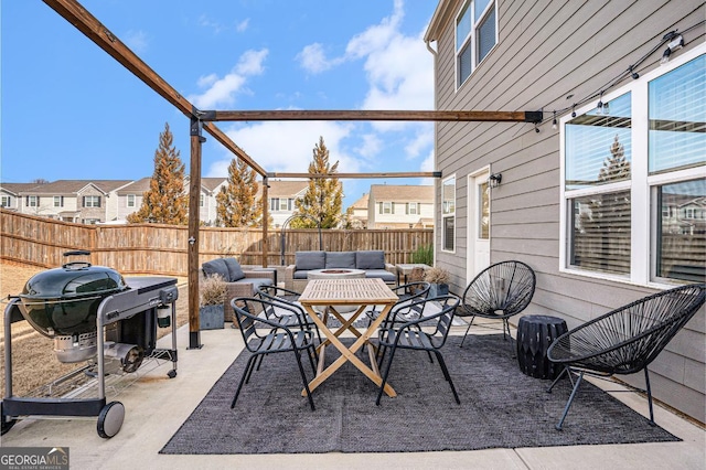 view of patio with area for grilling and an outdoor hangout area