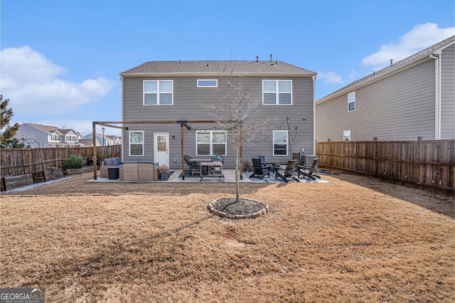 back of property with central AC, a patio area, and a lawn