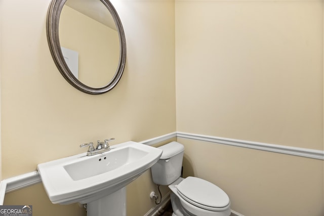 bathroom with sink and toilet