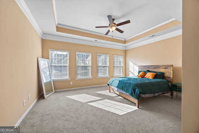 carpeted bedroom with crown molding, a raised ceiling, and ceiling fan