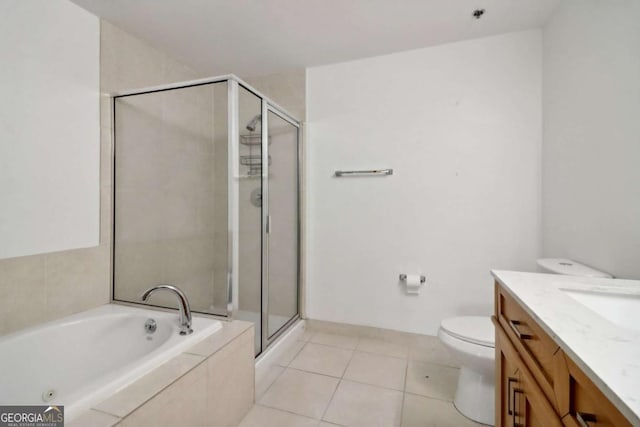 full bathroom featuring vanity, tile patterned floors, plus walk in shower, and toilet