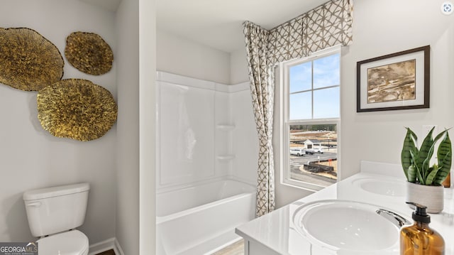 full bathroom featuring toilet, bathtub / shower combination, and vanity