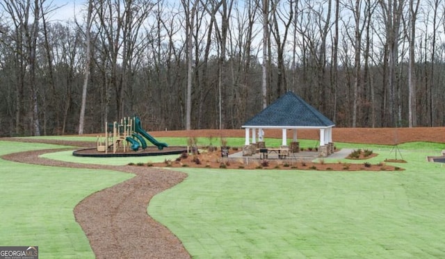 view of jungle gym featuring a lawn and a gazebo