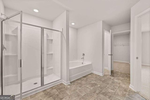 bathroom with separate shower and tub