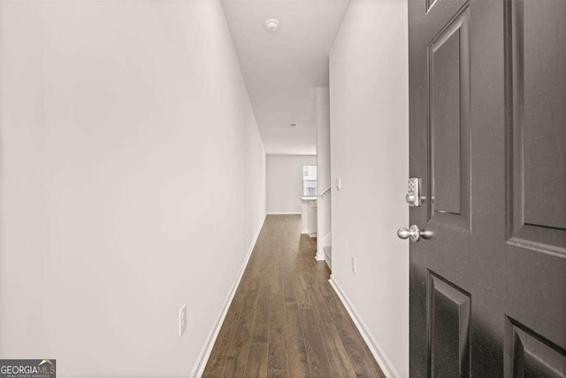 hall with dark hardwood / wood-style flooring