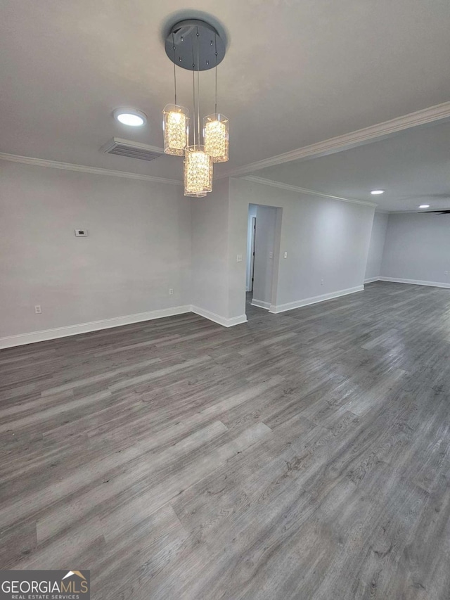 1295 Ga Highway 49, Macon, GA 31211 - empty room featuring wood finished floors, baseboards, a chandelier, ornamental molding, and recessed lighting