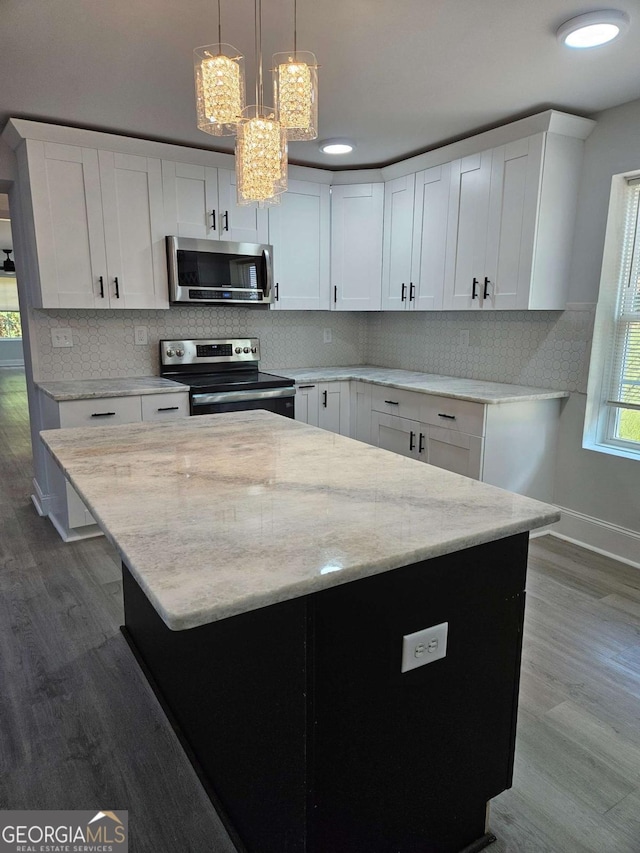 1295 Ga Highway 49, Macon, GA 31211 - kitchen featuring dark wood-type flooring, white cabinets, and stainless steel appliances
