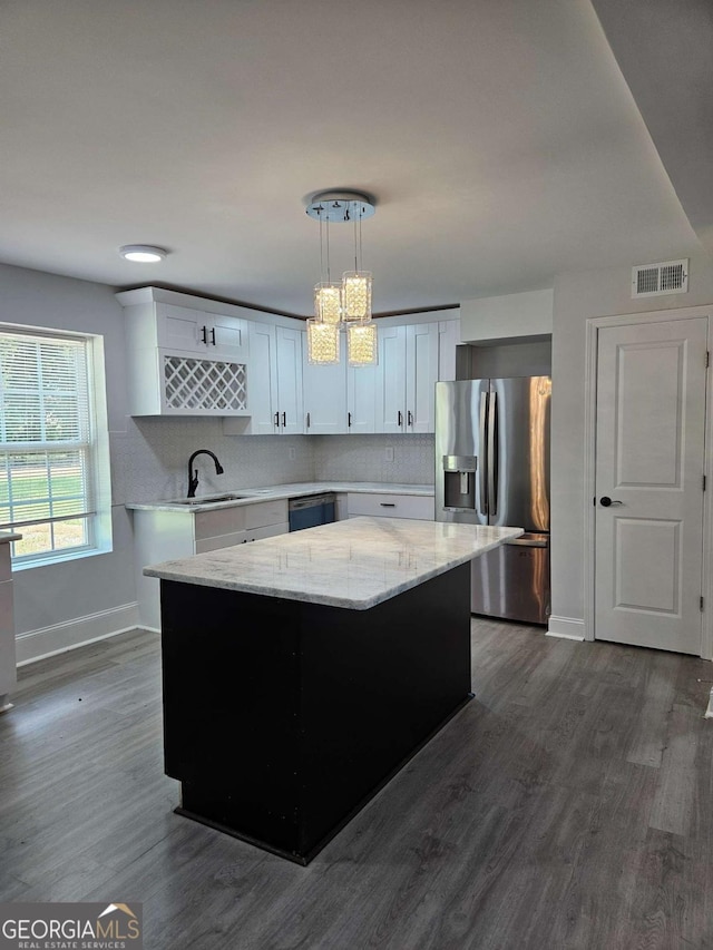 1295 Ga Highway 49, Macon, GA 31211 - kitchen with a kitchen island, stainless steel refrigerator with ice dispenser, visible vents, a sink, and baseboards