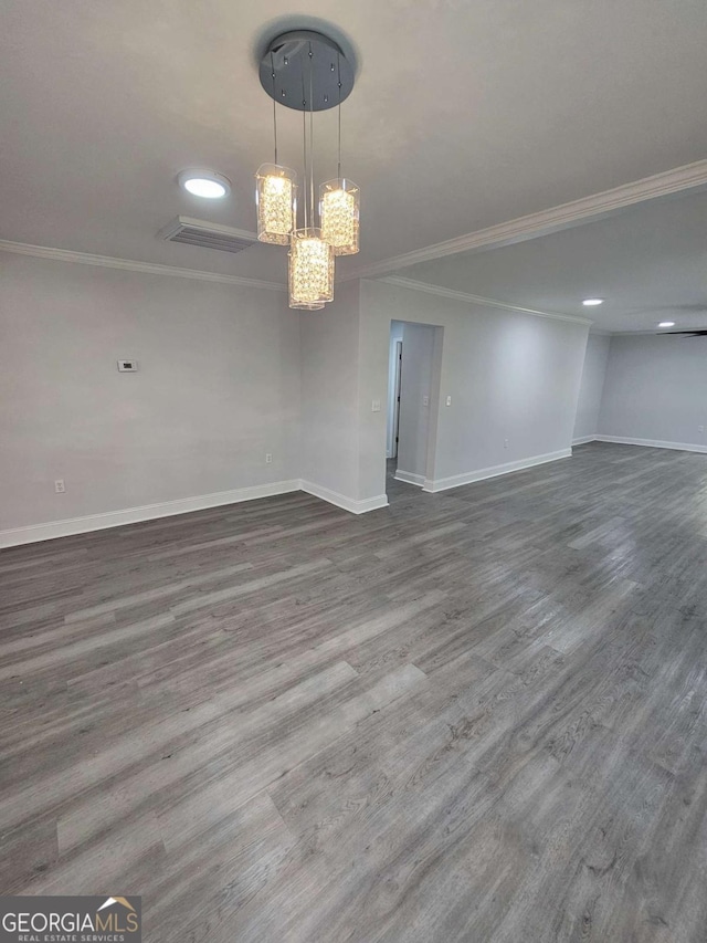 interior space with crown molding and wood-type flooring