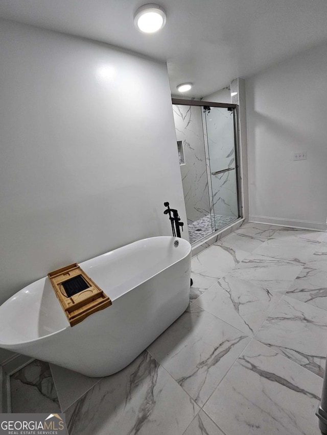 1295 Ga Highway 49, Macon, GA 31211 - bathroom featuring a freestanding tub, a marble finish shower, baseboards, and marble finish floor