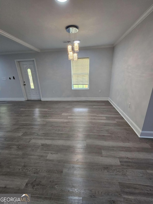 interior space with crown molding, plenty of natural light, and dark wood-type flooring