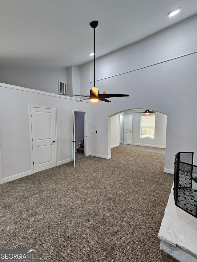 living room with carpet floors, high vaulted ceiling, and ceiling fan