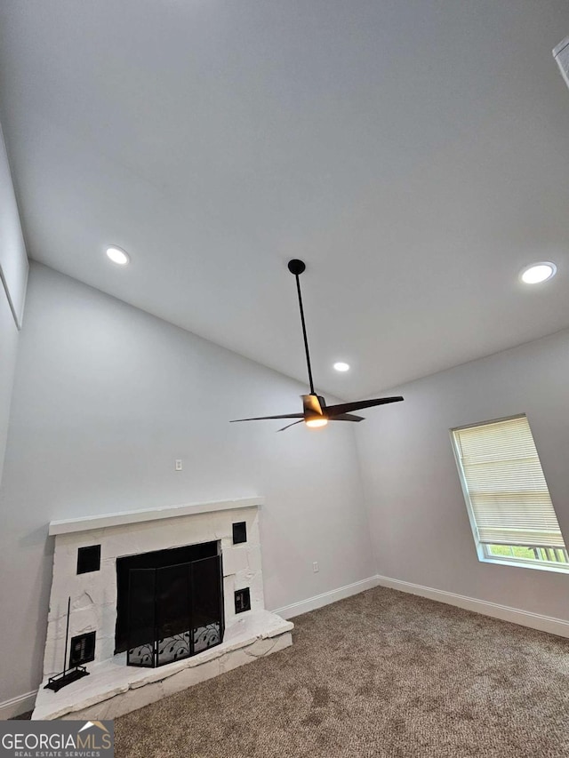 unfurnished living room with carpet flooring and ceiling fan