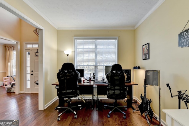 office area featuring hardwood / wood-style flooring, ornamental molding, and a textured ceiling