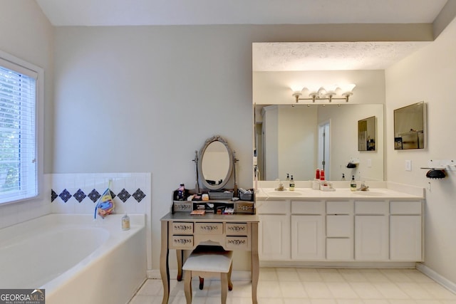 bathroom with vanity and a bathtub