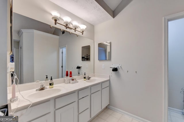 bathroom with vanity and a textured ceiling