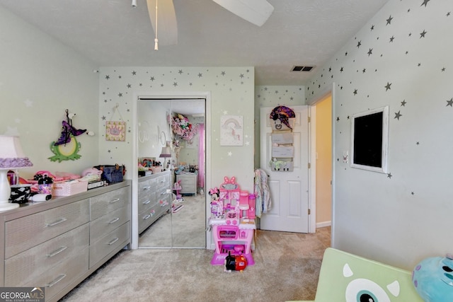 bedroom with light carpet and a closet