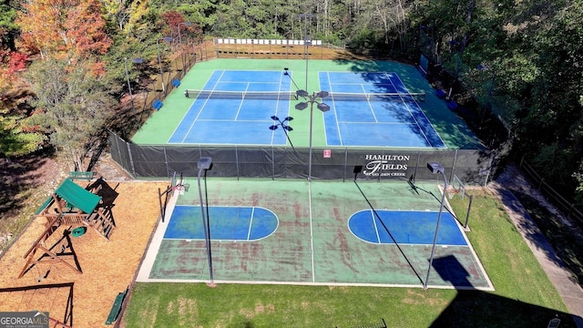 view of basketball court with a playground and tennis court