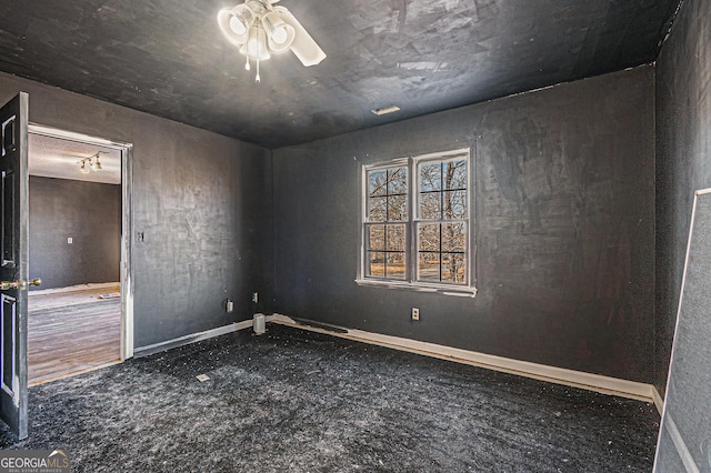 spare room with ceiling fan