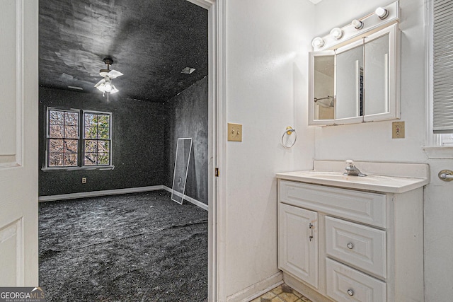 bathroom featuring ceiling fan and vanity