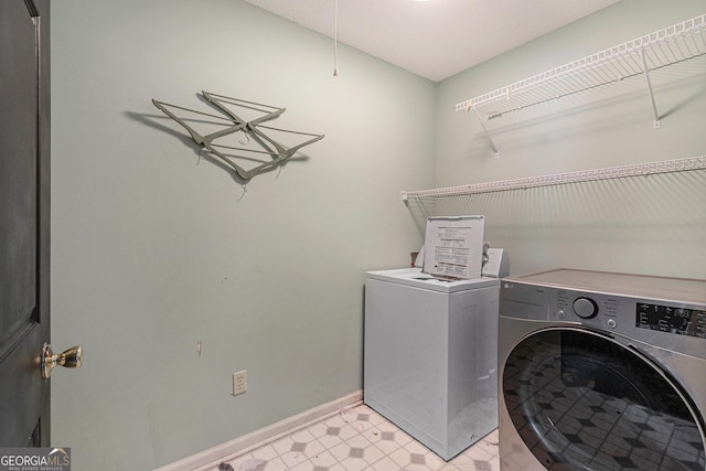 laundry room with washing machine and dryer