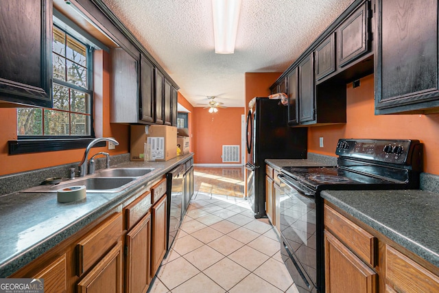 kitchen featuring sink, a textured ceiling, light tile patterned floors, ceiling fan, and black appliances