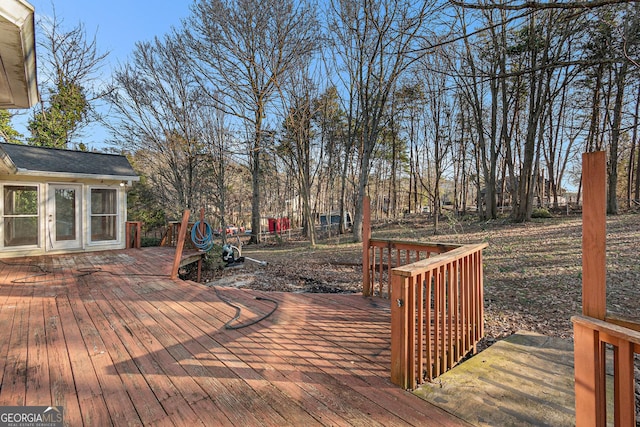 wooden deck featuring an outdoor structure