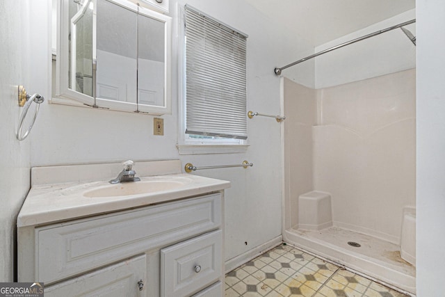 bathroom with vanity and walk in shower