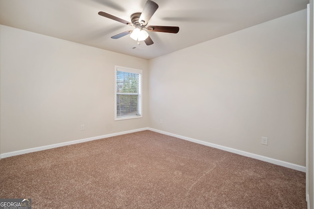 carpeted empty room with ceiling fan