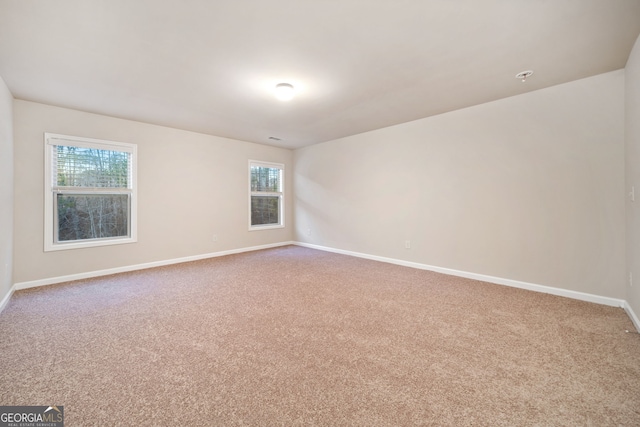 unfurnished room with carpet floors