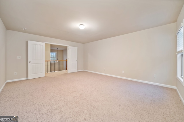 spare room with carpet floors